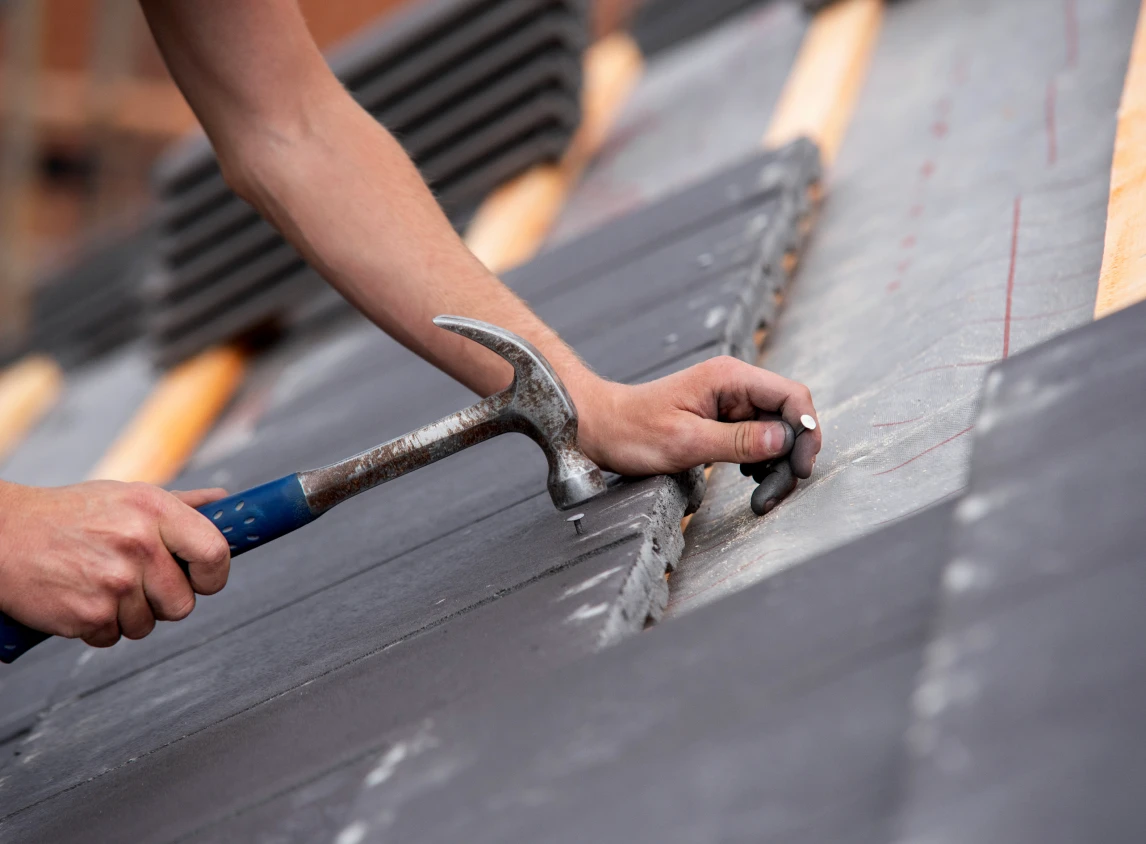 Installing tiles on a slanted roof